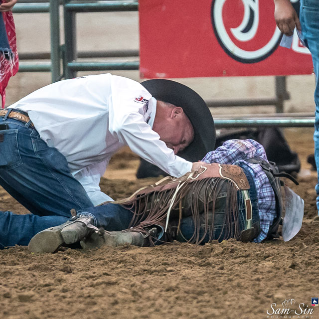 Justin Sports Medicine team member helping injured athlete.